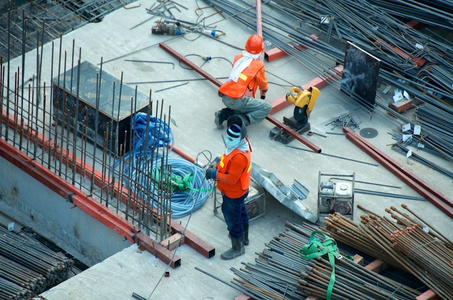 Aerial view of workers preparing a concrete slab